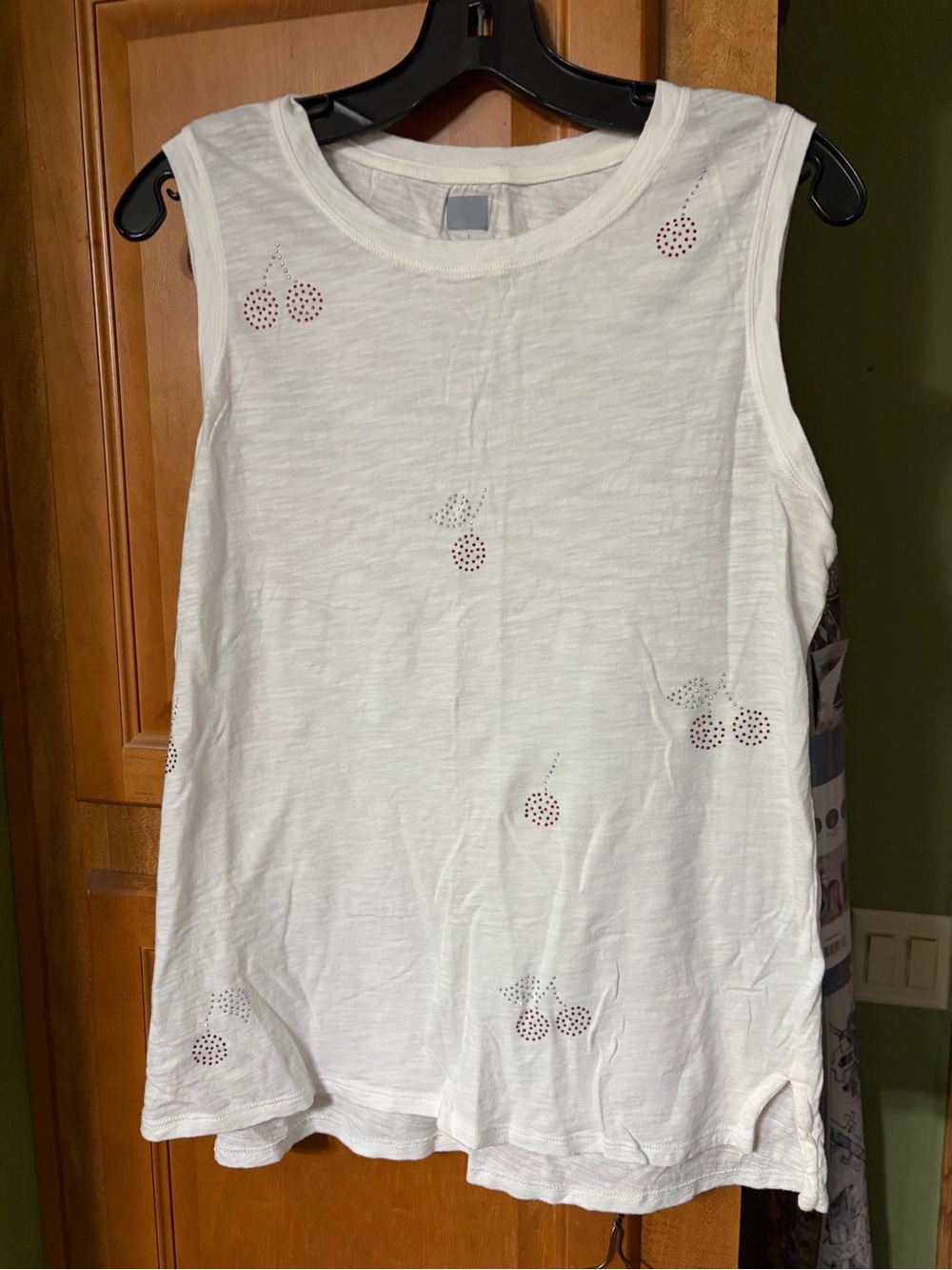 White Sleeveless Tank with Cherry Cutout Details and cut off Jean shorts